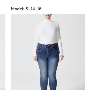 White Universal Standard foundation turtleneck